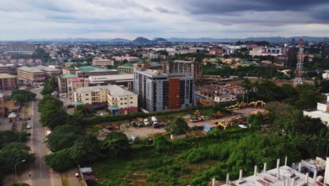 aerial of a urban construction site in abuja, nigeria. several lots are being developed in the capital of the african nation