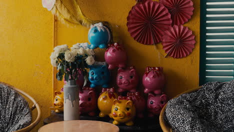 colorful piggy banks and decor inside coffee shop