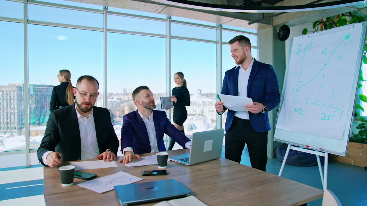 Teamwork, brainstorming concept. Young creative managers team working with new startup project in modern office.