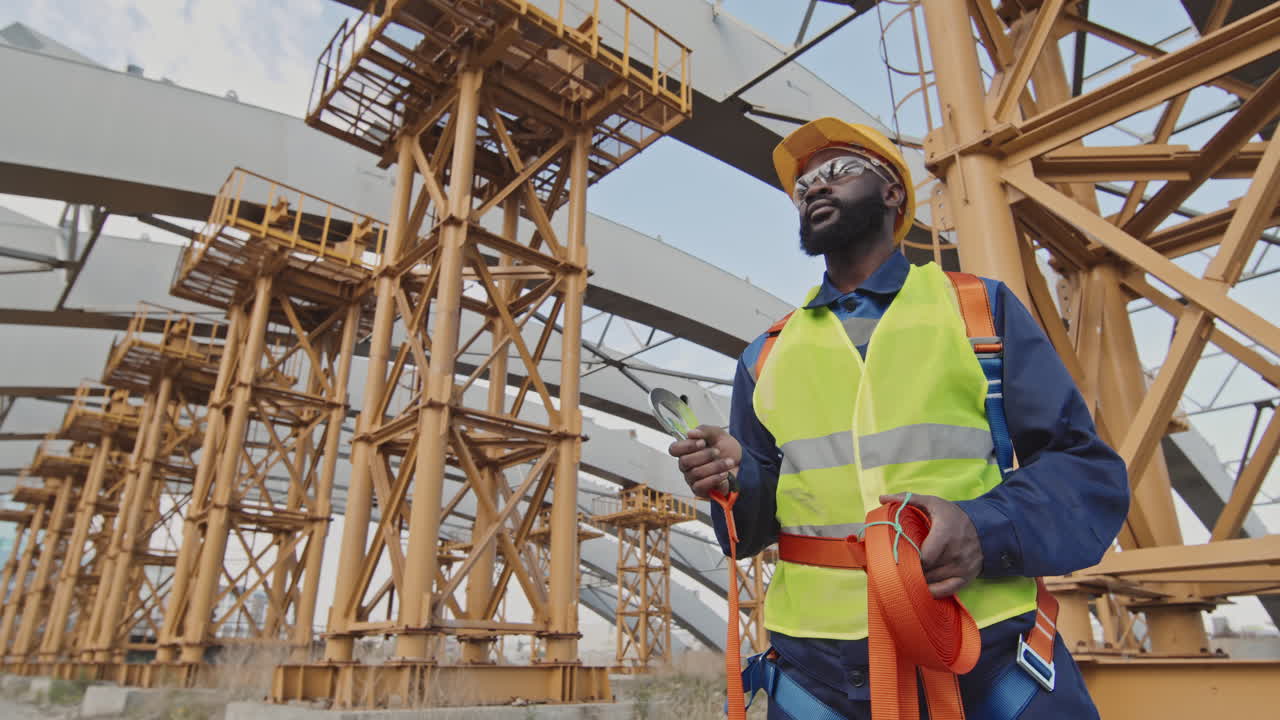 Construction Worker Holding Safety Belt Harness