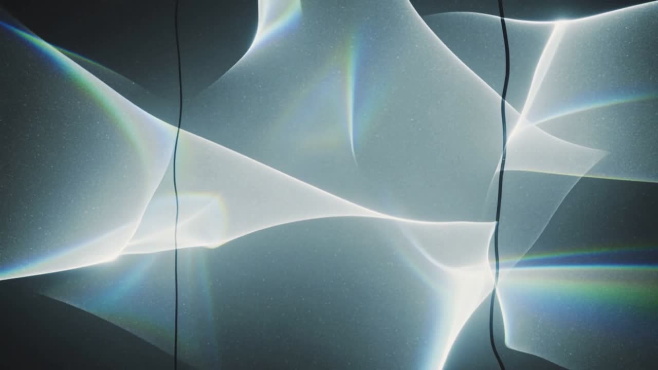 Vertical video: Projector pulsing, shifting light ribbons sliding across wall with vertical cords