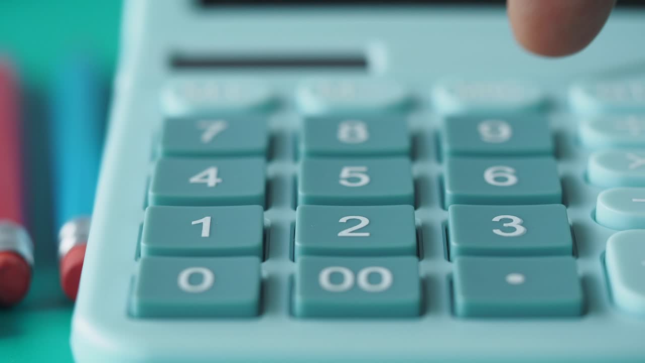 Person using a light blue calculator