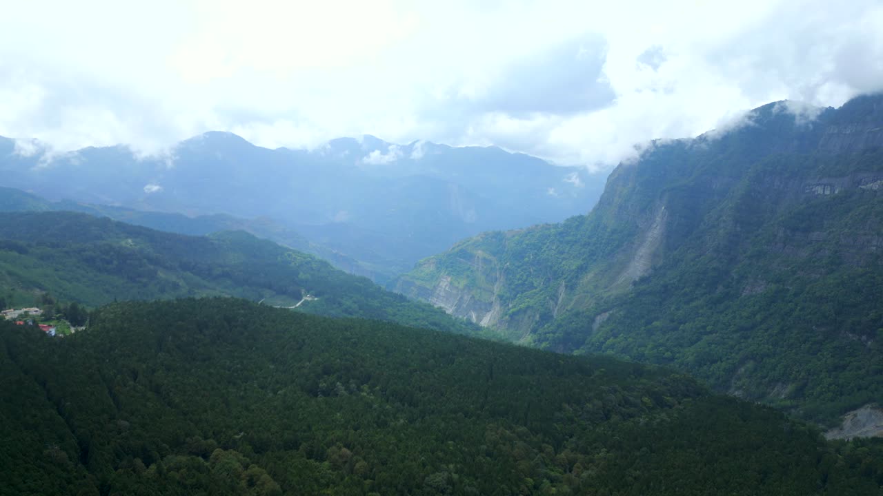 Aerial view of the densely forested mountains in Chiayi County, Taiwan.
