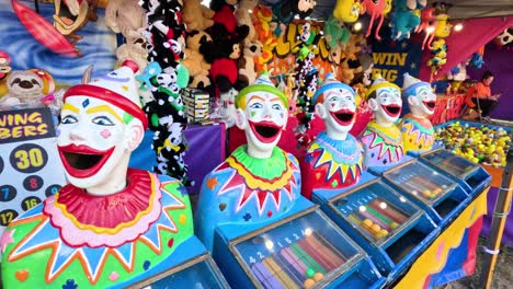 clown heads at a colorful carnival game