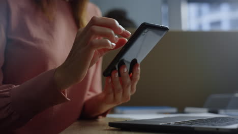 female employee holding cellphone