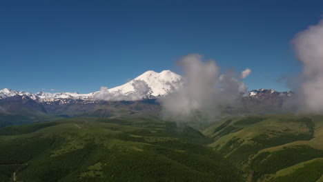 Elbrus-Region.-Flying-over-a-highland-plateau.-Beautiful-landscape-of-nature.-Mount-Elbrus-is-visible-in-the-background.