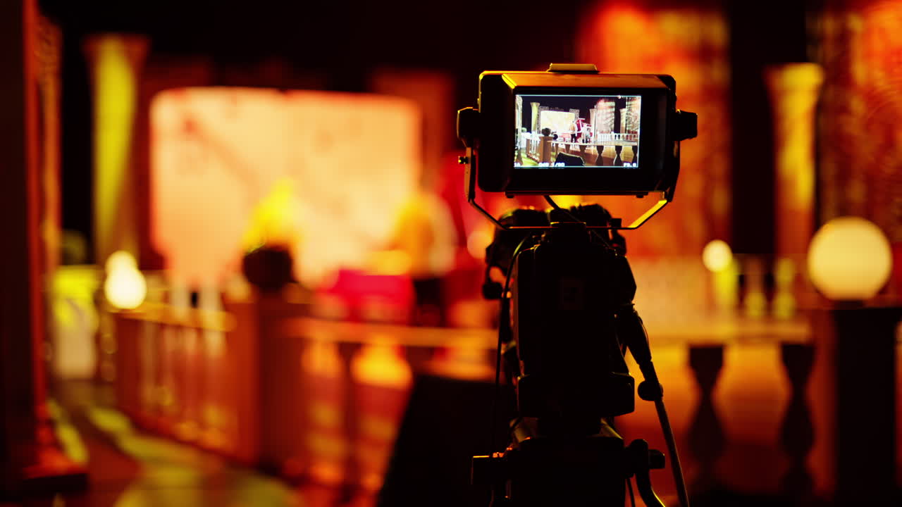 Professional camera filming with on the backstage of a TV set
