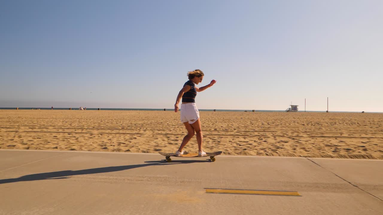 Woman Riding Longboard Then Catch On A Sunny Summer Day