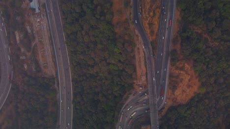 multi lane pune mumbai expressway through mountain valley, lonavala, maharashtra, drone shot