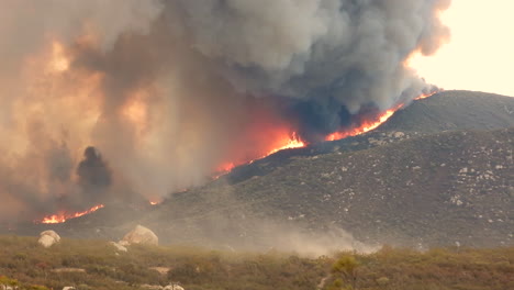 Wildfire-in-Fairview-raging-along-mountainside---blazing-fire-and-smoke