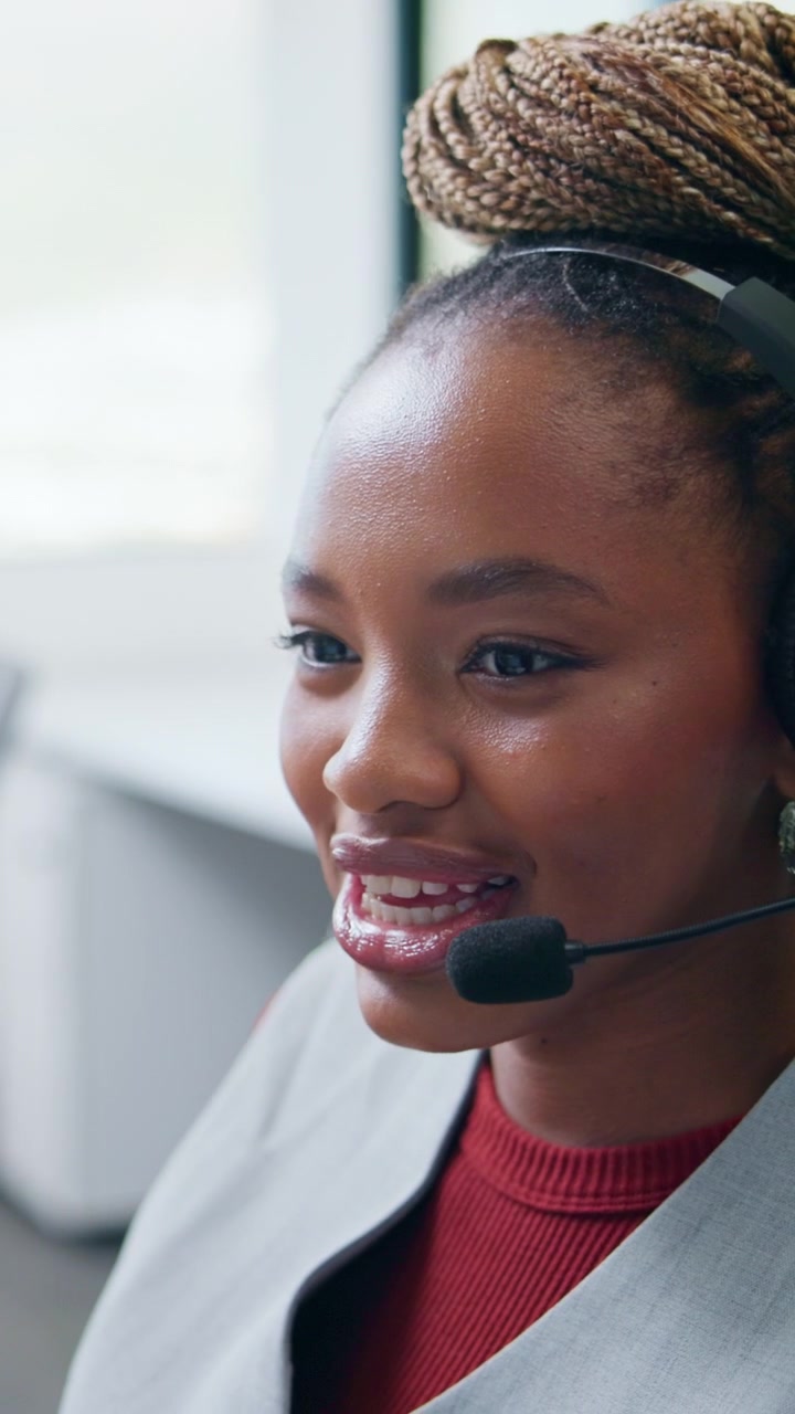 Friendly Customer Service Representative Talking on Headset in Office