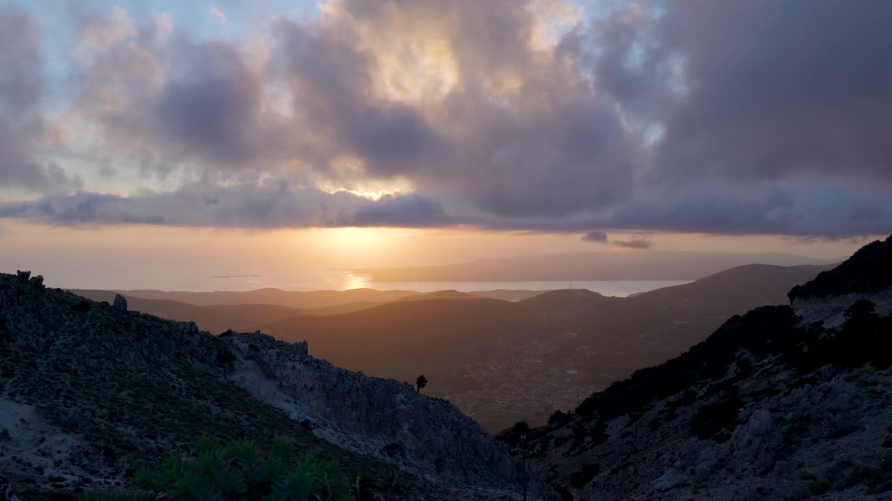 Sunset over Mountain Range with Sea View