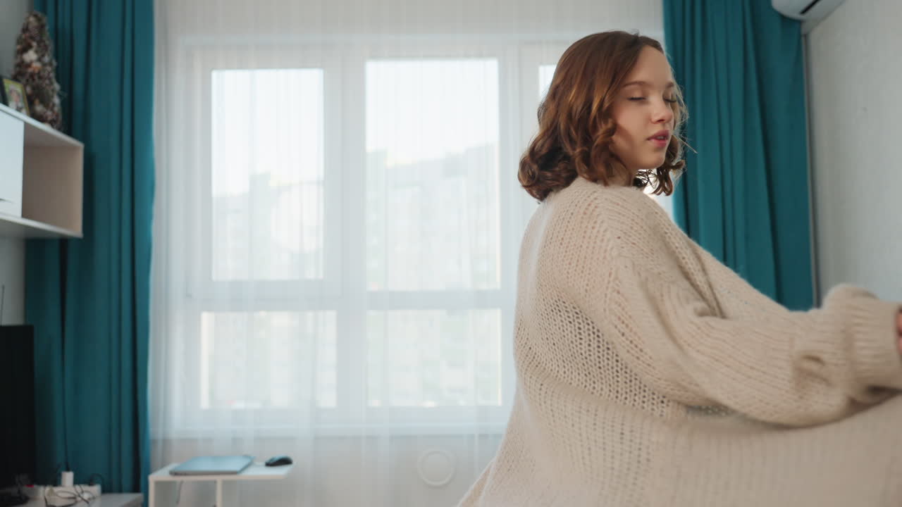 Casual Daylight Morning, Woman Strolling In Bright Room, Sunlit Living Space With Woman In Casual Clothing, Woman With Flowing Cardigan Enjoying Peaceful Morning In Her Bright Living Room