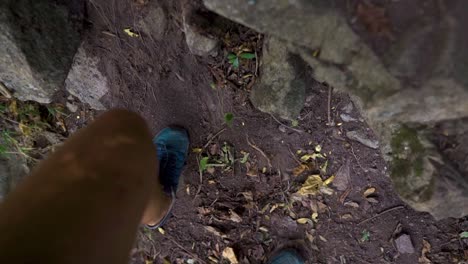 First-person,-close-up-view-of-person-walking-uphill,-rock-climbing