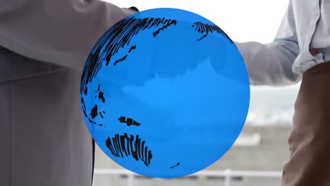 animation of globe over businessman handshake