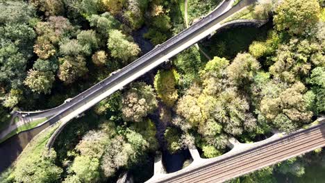 Static-overhead-aerial-drone-clip-of-the-Marple-Aqueduct-with-people-passing-and-River-Goyt-underneath