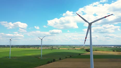 Aerial-view-of-powerful-Wind-turbine-farm-for-energy-production-on-beautiful-cloudy-sky-at-highland