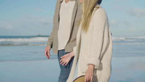 romantic caucasian couple strolling along the beach