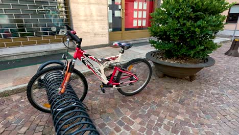 bicycle parked in a cobblestone alley