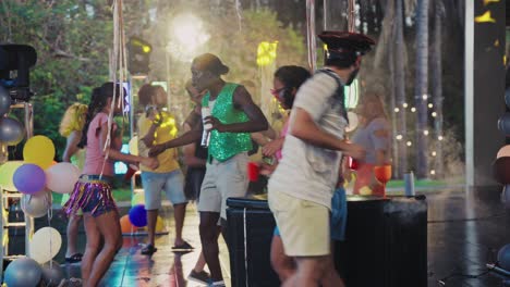 vibrant outdoor night party with diverse group dancing and celebrating