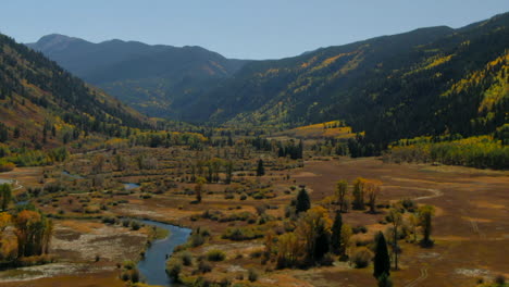 Independence-Pass-Colorado-summer-fall-autumn-colors-aerial-drone-cinematic-Aspen-Snowmass-Mountain-Ashcroft-Maroon-Bells-Pyramid-Peak-beautiful-stunning-blue-sky-mid-day-sunny-upward-movement