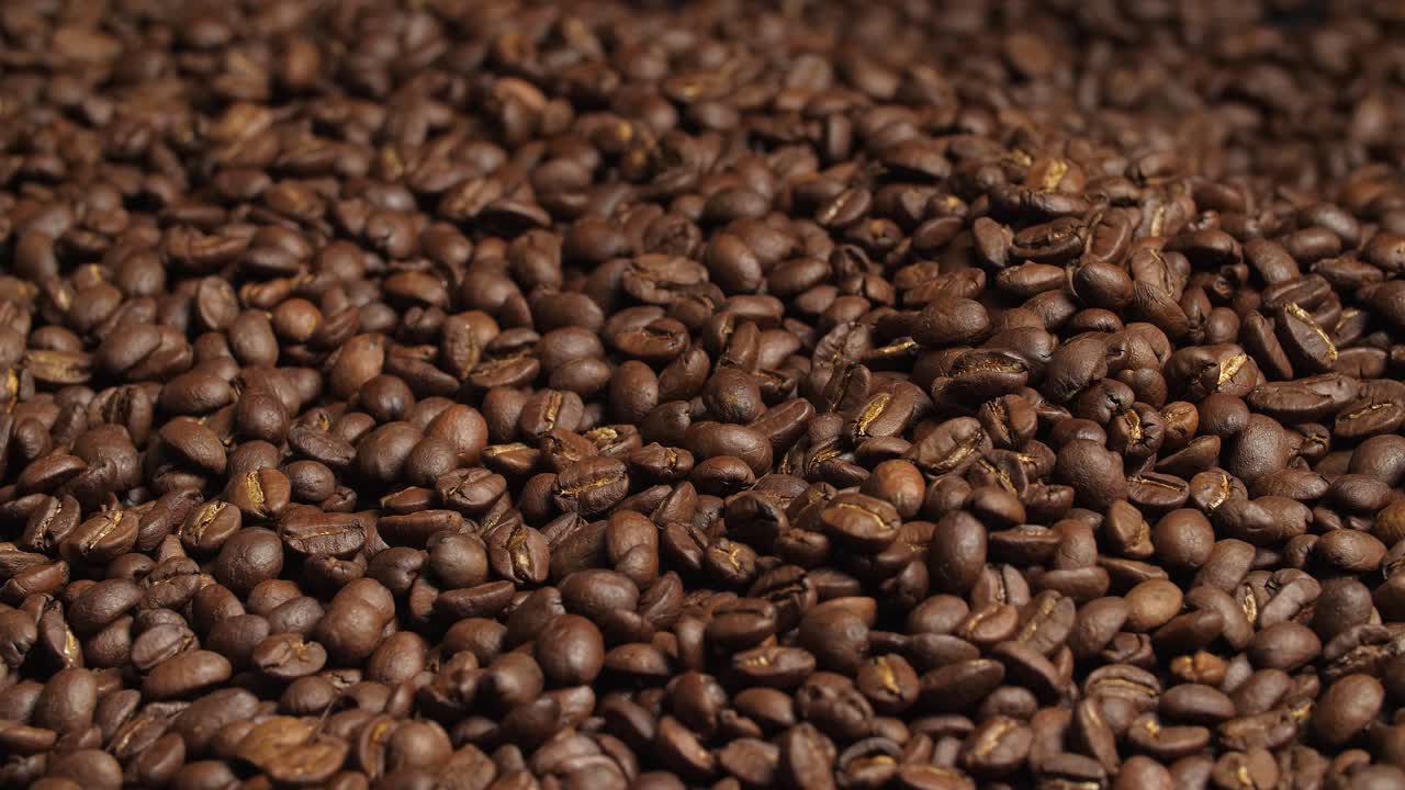 Close Up Hand Touching Roasted Coffee Beans, Video In 4K, 50Fps