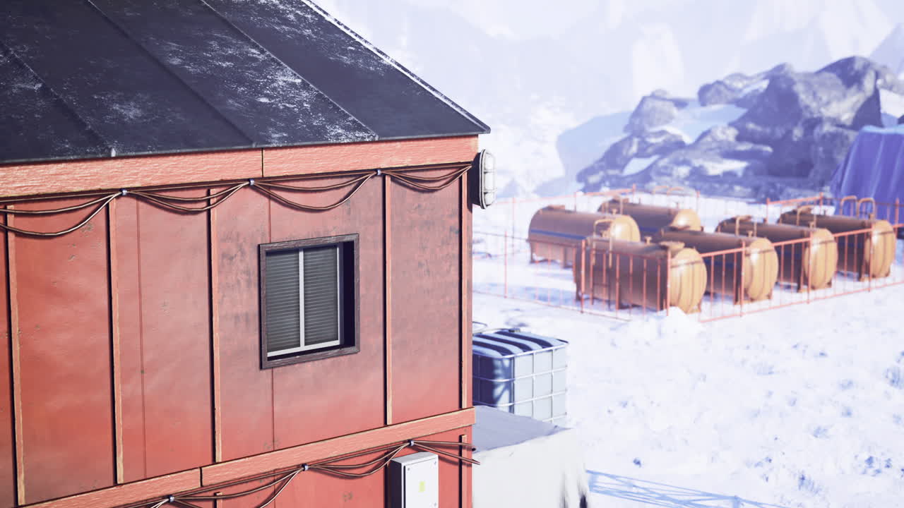 Winter research station in a snowy landscape with storage tanks nearby