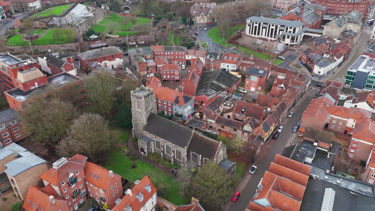 Norwich, showing historic church, streets, shops, and a vibrant town vibe, aerial view