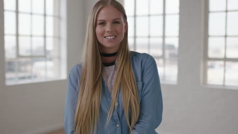 slow motion portrait of beautiful young blonde woman laughing happy enjoying successful lifestyle move in new apartment