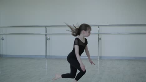 young ballet girl at studio lesson. training performance. stretching exercise pose. ballerina practice balance technique. classical elegance fitness.