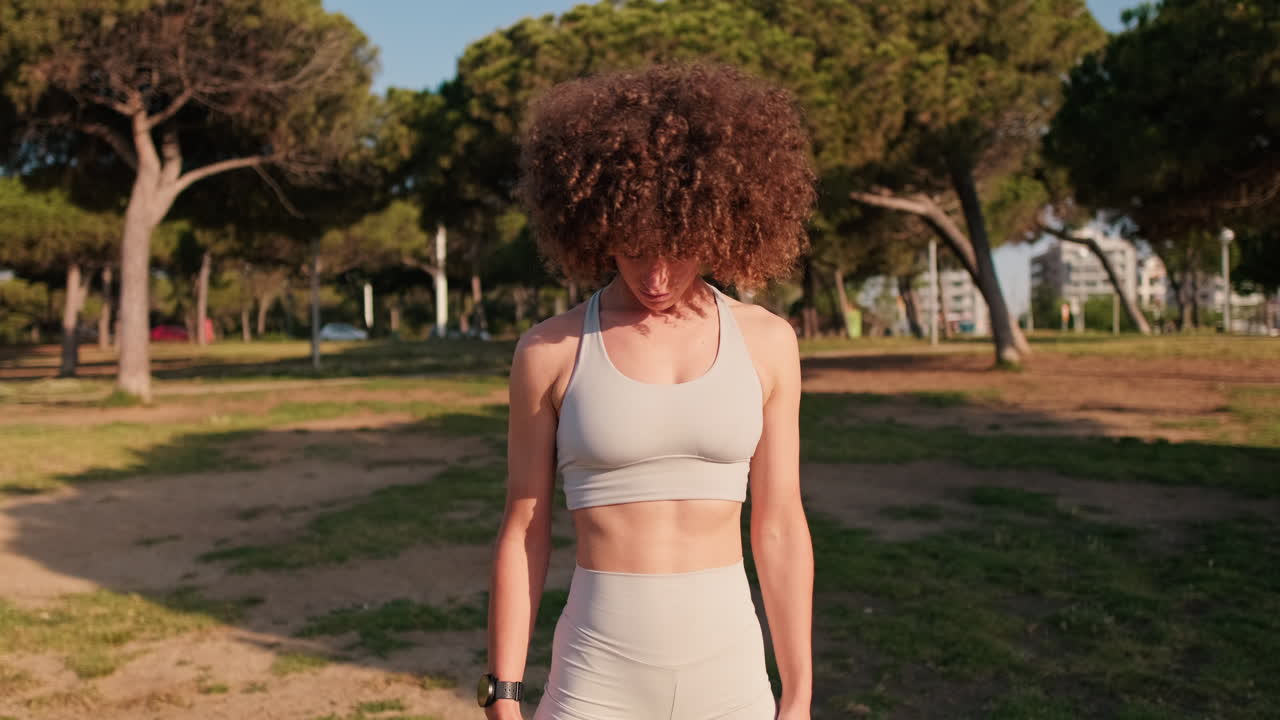 Woman Stretching Neck in Park Fitness