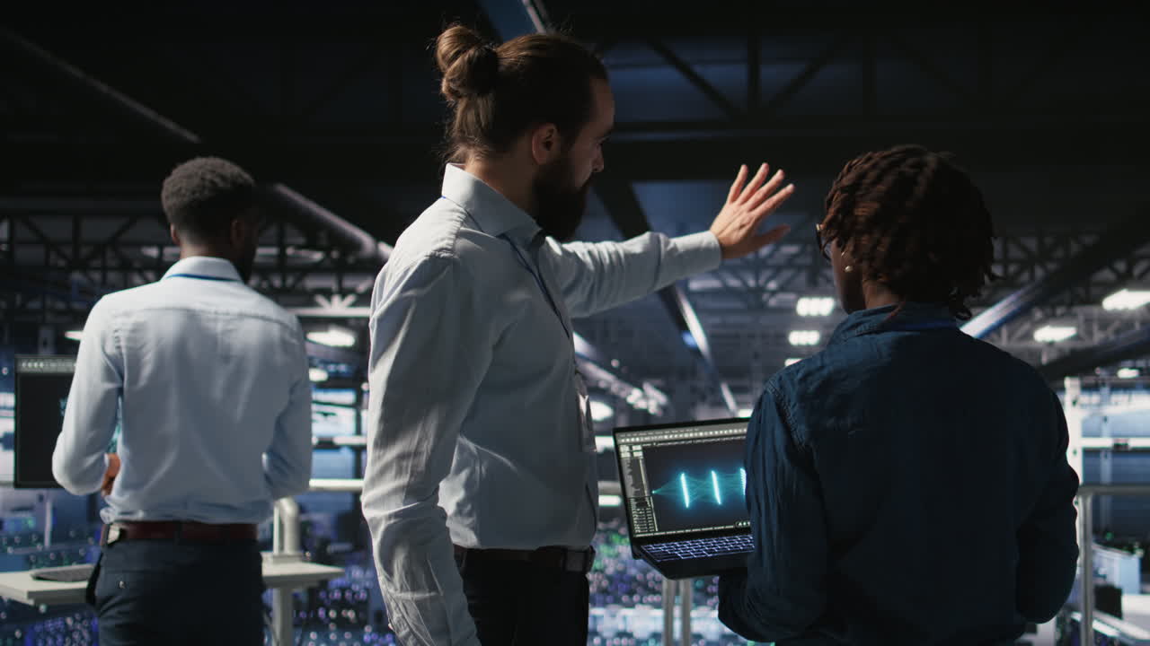 Server farm manager overseeing work done by engineer reviewing LLM visualization