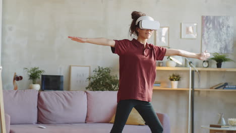 young woman in vr headset exercising at home