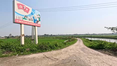 a road passing through lush green fields