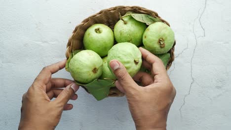 green guavas in a basket