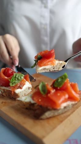 woman eating salmon toast