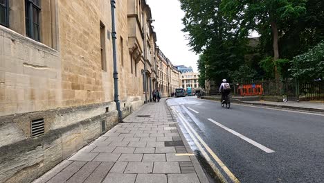 pedestrians and cyclists on a historic street