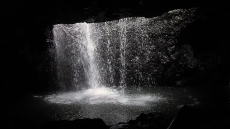 View-of-the-waterfall-in-Natural-Bridge,-Springbrook-National-Park,-Gold-Coast-Hinterland,-Australia