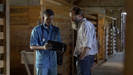 veterinarian and farmer handshaking