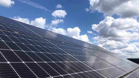 single-solar-panel-time-lapse-of-clouds-passing-in-blue-clear-sky-during-bright-sunny-day-with-reflection-on-the-photovoltaic-panel-great-reset-agenda-2030-concept