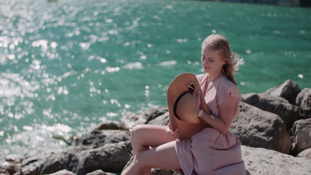 Woman Relaxing by the Seaside in Summer Dress
