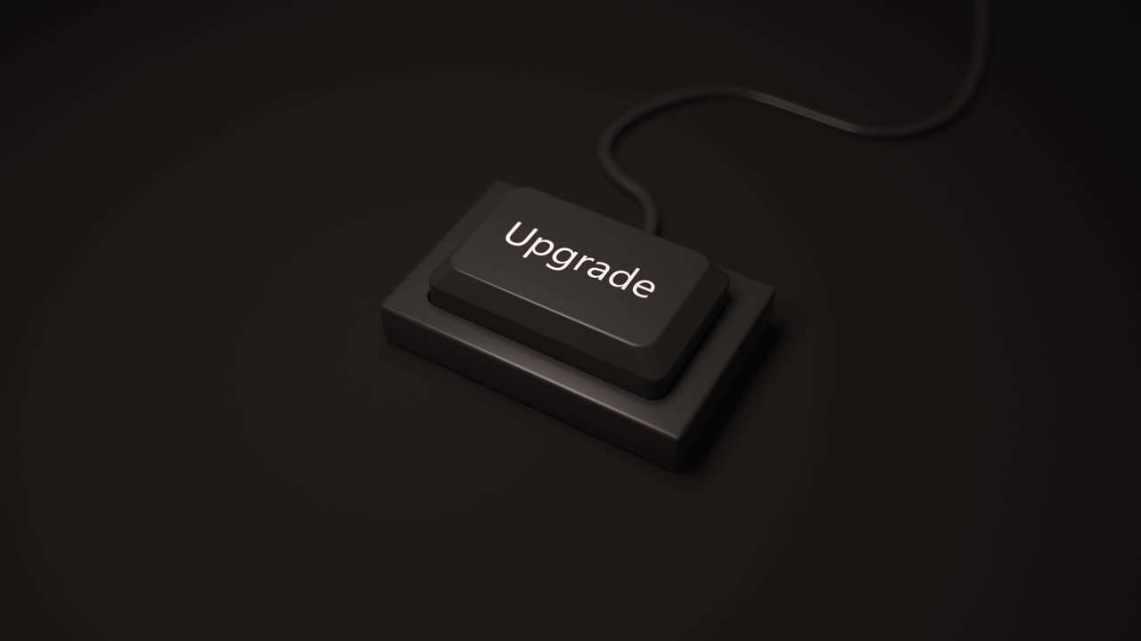 Minimalist button key with the inscription UPGRADE by pressing in black color.