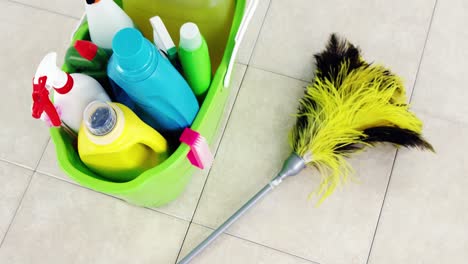 various housekeeping supplies in a bucket