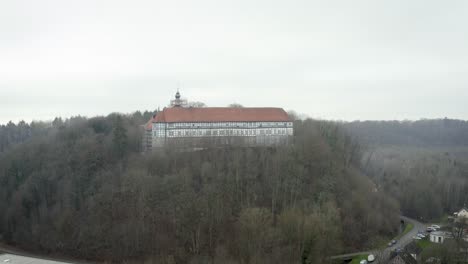 drone aerial view of the traditional german village herzberg am harz in the famous national park in central germany on a cloudy day in winter.