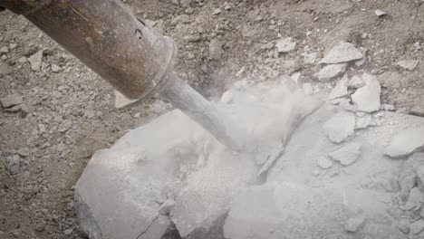 Jackhammer-breaking-up-sidewalk-rocks