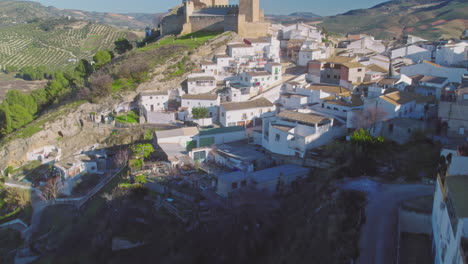 aerial reveal of the village and castle of iznájar