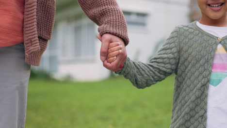 Family,-parent-and-child-holding-hands-outdoor