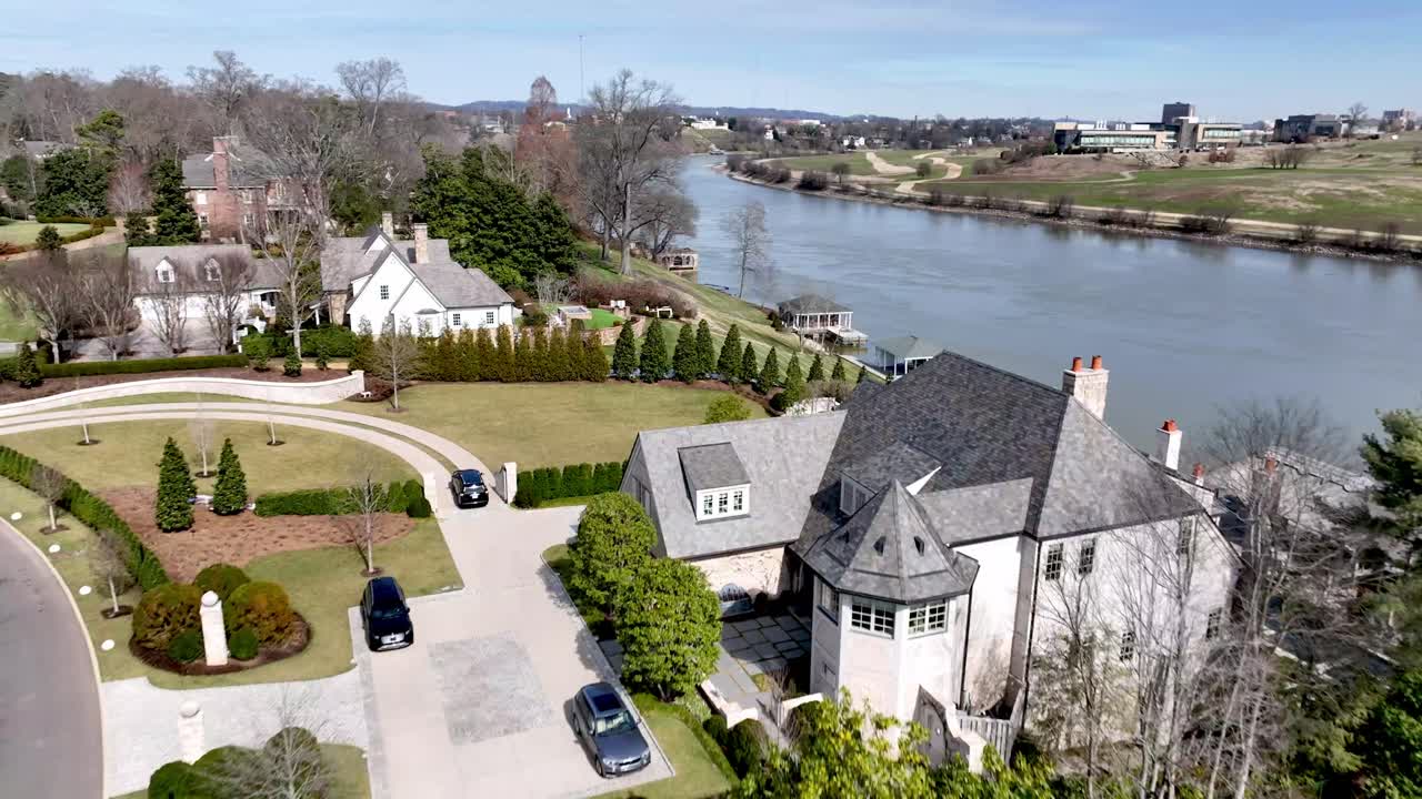 fast aerial over luxury homes in sequoyah hills along the tennessee river