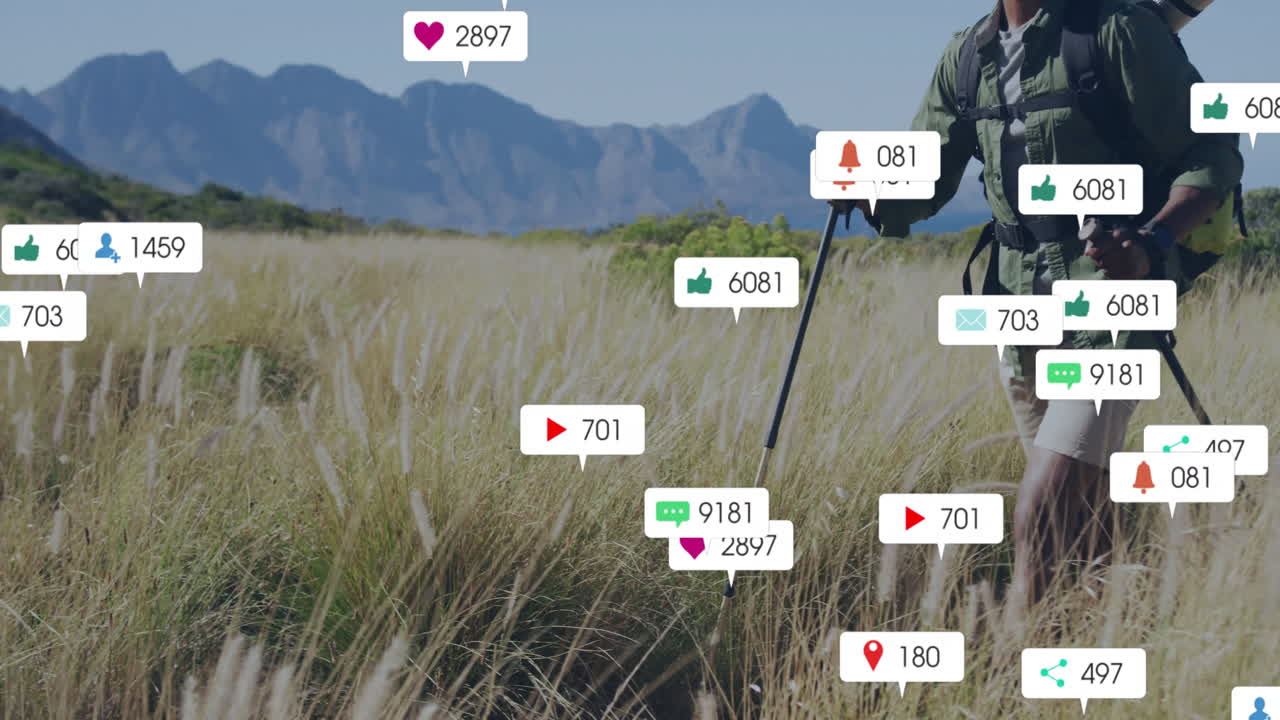 Hiker trekking in golden grass field, with floating social media icons for digital marketing