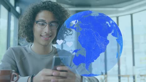 Animation-of-globe-and-hearts-over-smiling-biracial-man-using-smartphone